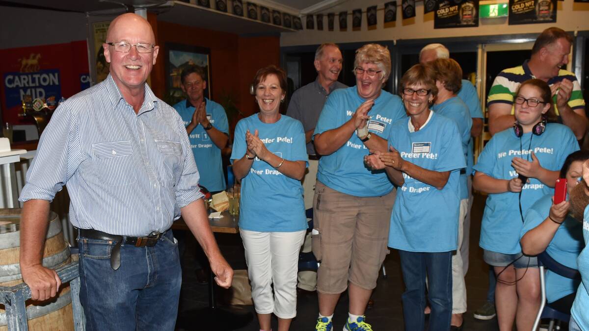 WELL DONE: Supporters give Peter Draper a resounding cheer after conceding defeat in Saturday’s state election. Photos: Geoff O’Neill 280315GOI16