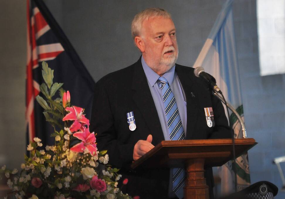SOMBRE SERVICE: Superintendent Clint Pheeney delivered a moving address at yesterday's ceremony. 290914GOA03