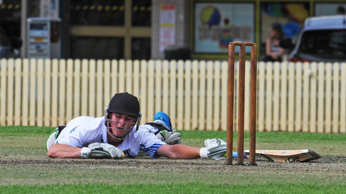 Narrabri’s Sage Cook takes a sigh of relief after just making his crease playing for CHS II yesterday at No 1 Oval in the NSW Schoolboy Championships. Photo: Chris Bath 130315CBA01