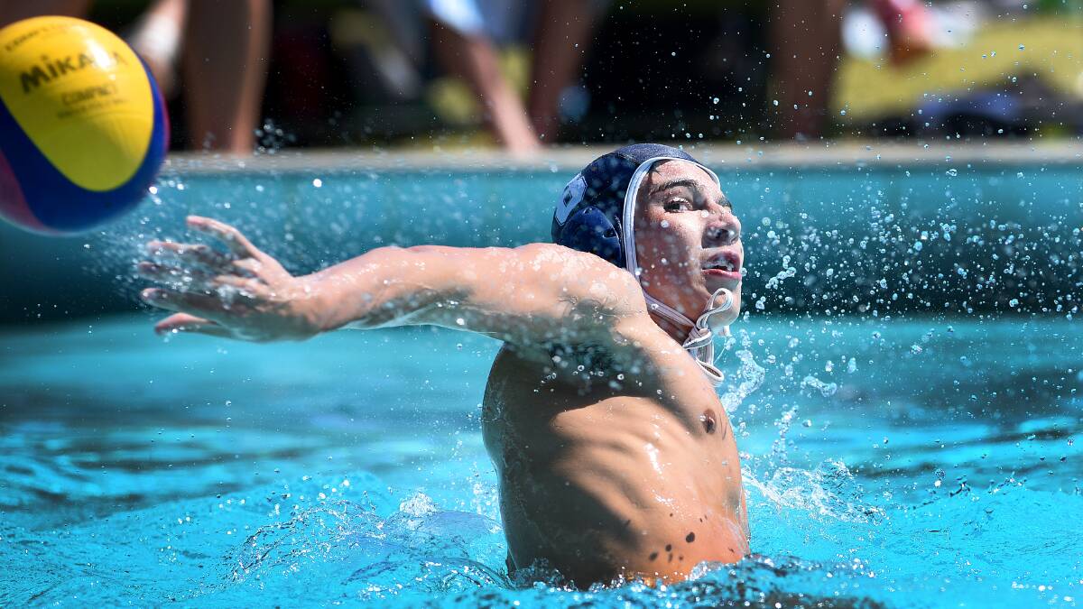 Cronulla’s Samuel Rose takes a backhand shot at the State Under 14 Water Polo Championships. He scored a goal in yesterday’s 5-2 grand final win over Sydney Uni for his Sharks.  Photo: Gareth Gardner  140215GGB15