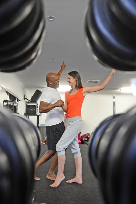 I feel like dancin’: Dwone Jones and Lauren Mettam practising their dance moves at 360 gym.  Photo: Barry Smith  280514BSE06