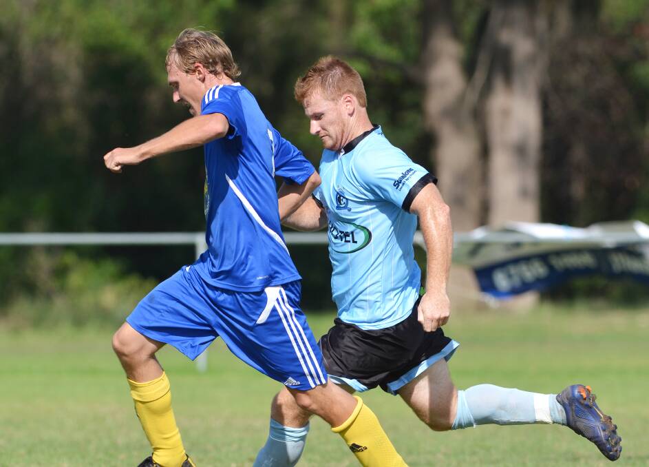  Moree FC’s Josh O’Neill takes control against Tamworth FC’s Goulburn-bound Jarryd May last Saturday. TFC won 3-1 and play OVA in a local derby tomorrow while Moree is off to Narrabri/Wee Waa. Photo: Barry Smith 050414BSF22