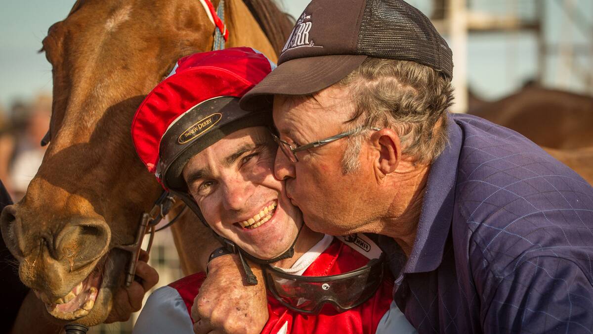 Trainer Noel Boland embraces jockey Michael Hackett after Husisname had won his first Louth Cup in 2011. Photo courtesy Janian McMillan 
racing.photography.com.au