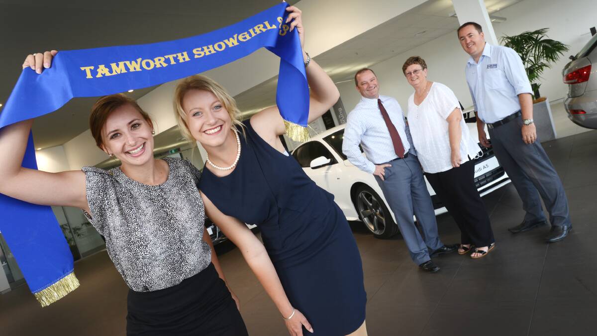 SHOWROOM SHOWGIRLS: Entrant  Maddy Long with reigning  Showgirl Danielle Robson have launched this year’s quest with the help of Tamworth Audi GM Jon Dawe, left, and sales executive Jason McGregor and showgirl 
co-ordinator Ros Riggs. Photo: Barry Smith 060214BSA03