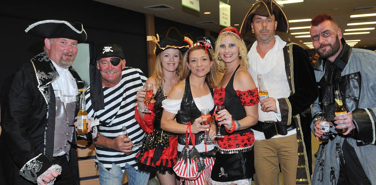SHIVER ME TIMBERS: From left, Andrew Fogarty, Mick Pooley, Larissa Fogarty, Sonya McBride, Jodie Garnett, Nigel Reeves and Ben Jamin got into the spirit at the Pirates of Treasure Cove Charity Ball on Saturday night. Photo: Geoff O’Neill 290314GOF08