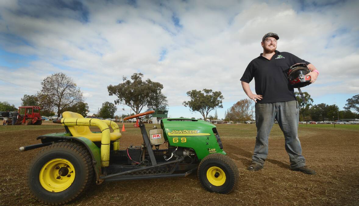 READY TO ROAR: Adam Edwards from Inverell’s Mower Sports Club cuts a fearsome figure – but not any grass – as he prepares to race his ride-on at the weekend’s Manilla Vintage Farm Machinery Show. Photo: Barry Smith 0706BSD07