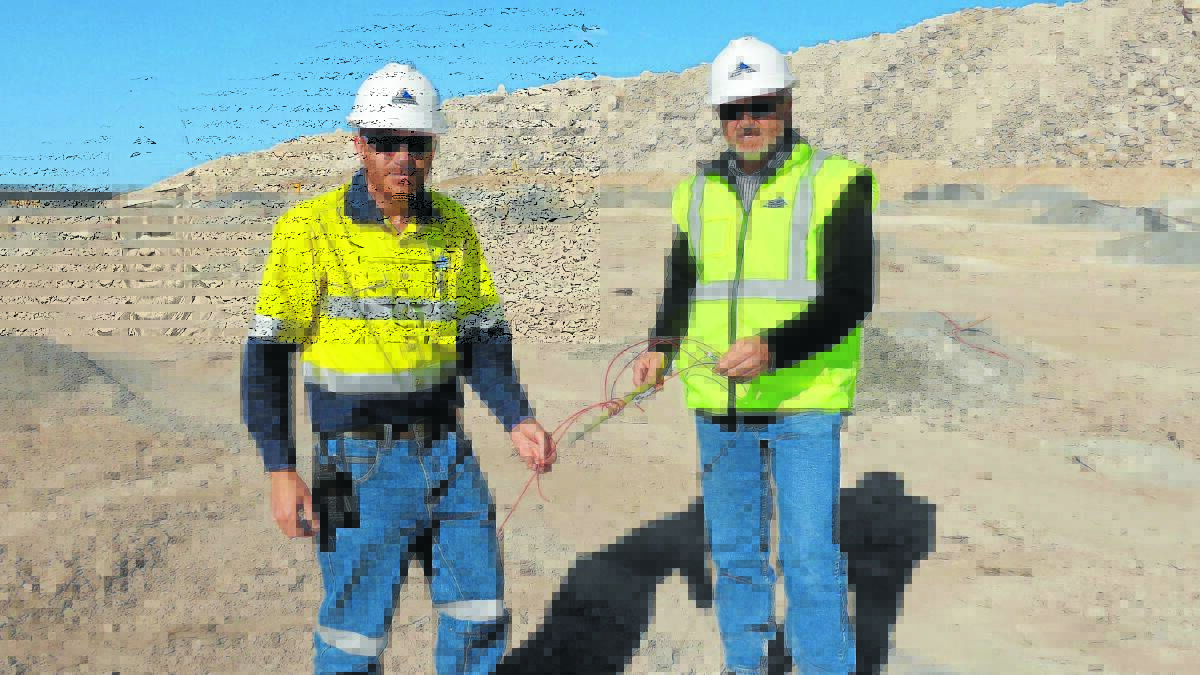 TOO FAR: Workers at the Maules Creek mine near Boggabri show off some of the explosive lines allegedly sabotaged by anti-coal protesters in an act that has been described as one of ‘colossal stupidity’.