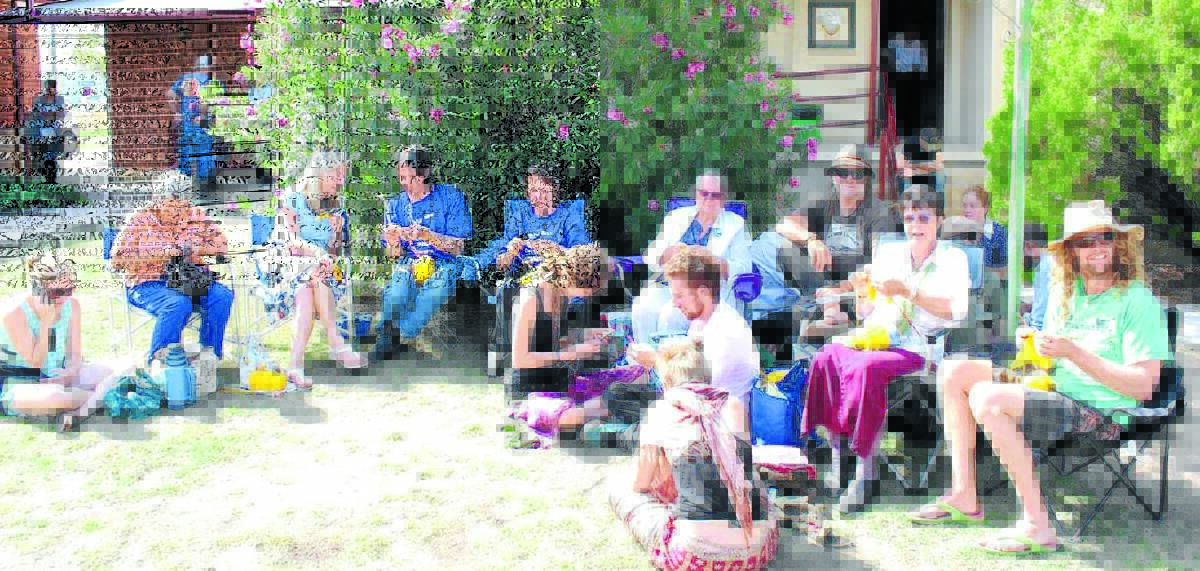 SHOW OF ACTION: The group of knitting nannas takes a stand in front of the Narrabri Court yesterday as dozens of protesters front up on charges.