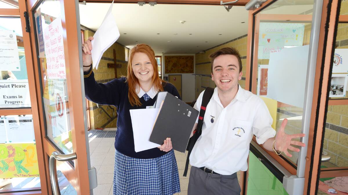 BYE, TEACHERS! Maddie Sanson and Alex Leonard have celebrated their last day of school with the legal studies and extension English I exams. Photo: Barry Smith 291014BSA03