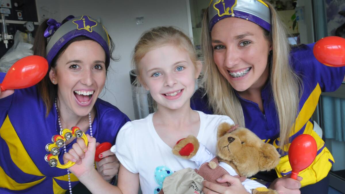 BRIGHTER DAY: Tamworth hospital patient Georgia Sheppard felt a whole lot better after a visit by the ‘Captains’ Starlight.
Photo: Geoff O’Neill 260314GOA01
