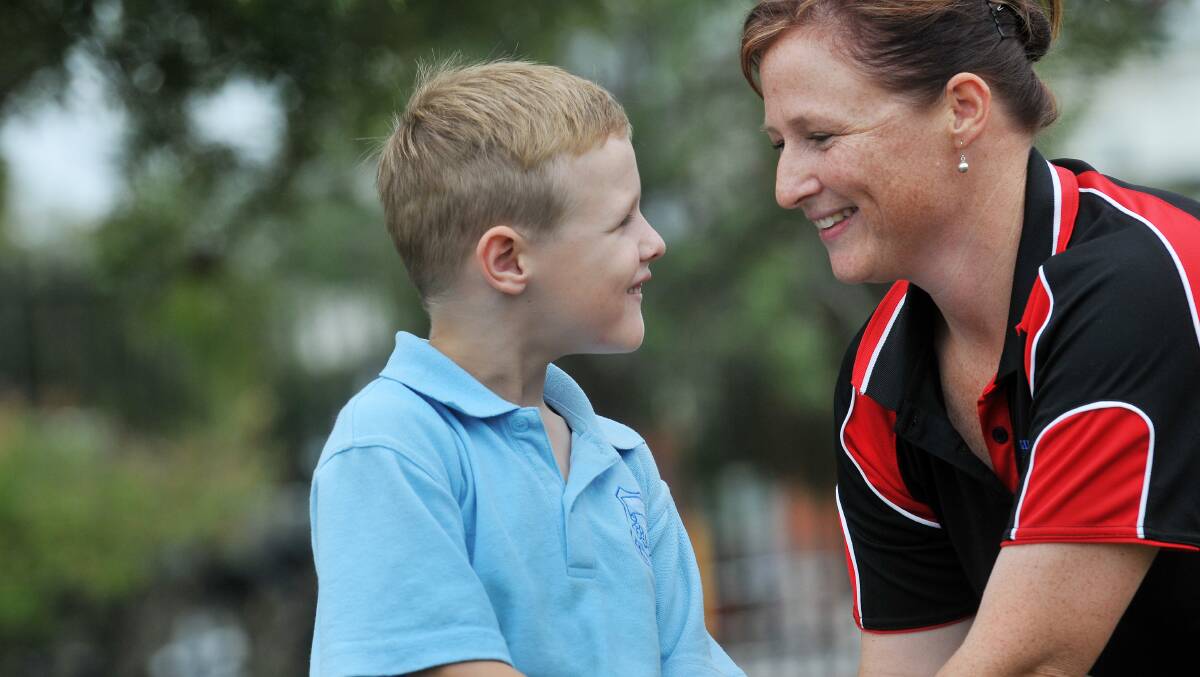 LOT OF LOVE: Lisa Jenner, with son Cody, is embarking on a world-first initiative aimed at parents of children with a disability. Photo: Gareth Gardner  280214GGF06
