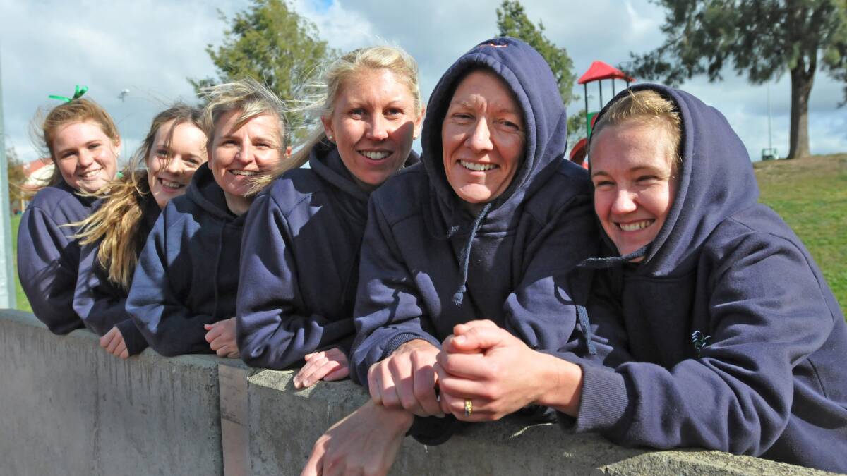 WEATHER WOMEN: From left, Tessa Pennefather, Jess McIntosh, Michelle Aslin, Liz Thomas, Kater Perrett and Heather Carr were hit with chilly and windy conditions at the hockey fields in Tamworth yesterday. Photo: Geoff O’Neill 290614GOB01
