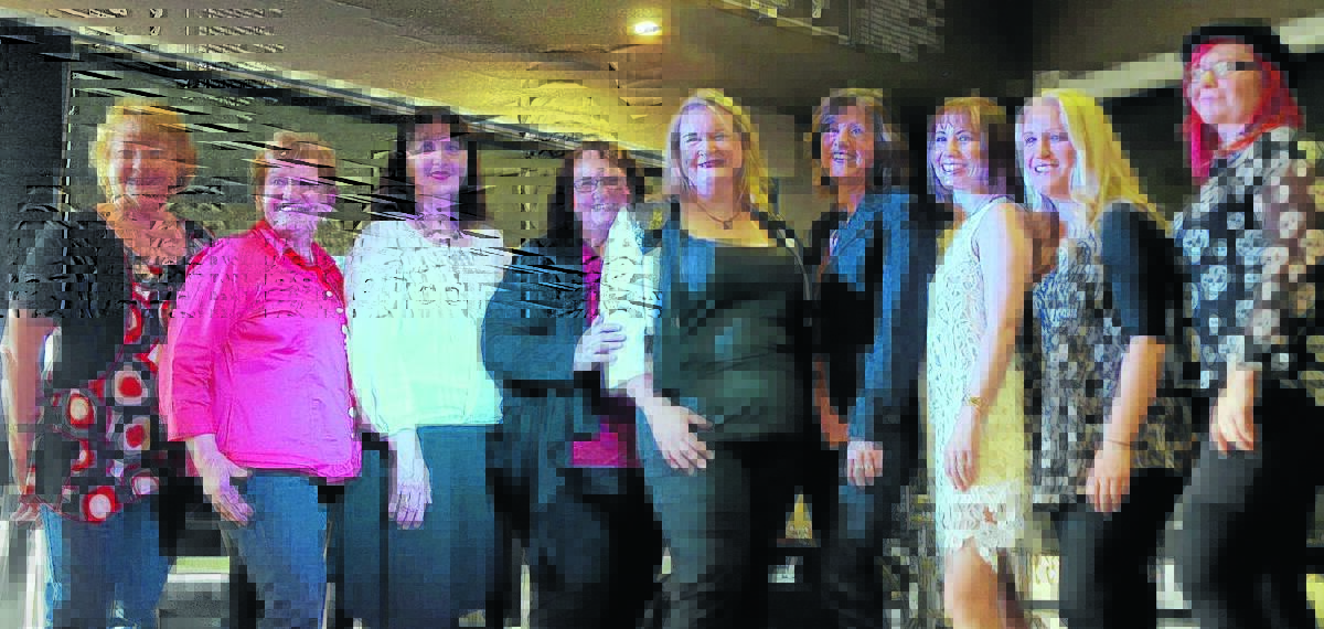 SISTERS IN SONG: Christina George, Patti Morgan, Lynette Guest, Wendy Wood, Tracy Coster, Anne Kirkpatrick, Sally-Anne Whitten, Johanna Hemara and Allison Forbes at the standing-room-only, CCMA all-girl salute to Anne Kirkpatrick at South Tamworth Bowlo on Sunday. Photo: Mel Birrell 
