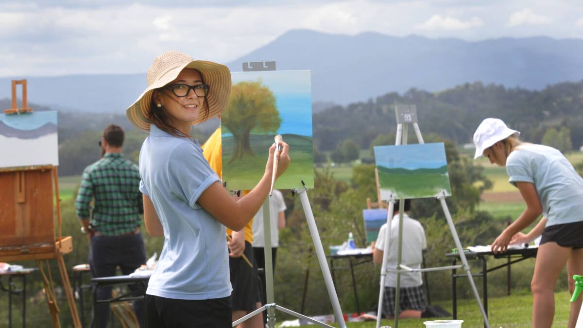 PICTURE THIS: Jessie Browne from Tamworth High makes the most of the view from Farrer. Photo: Geoff O'Neill 100414GOB01