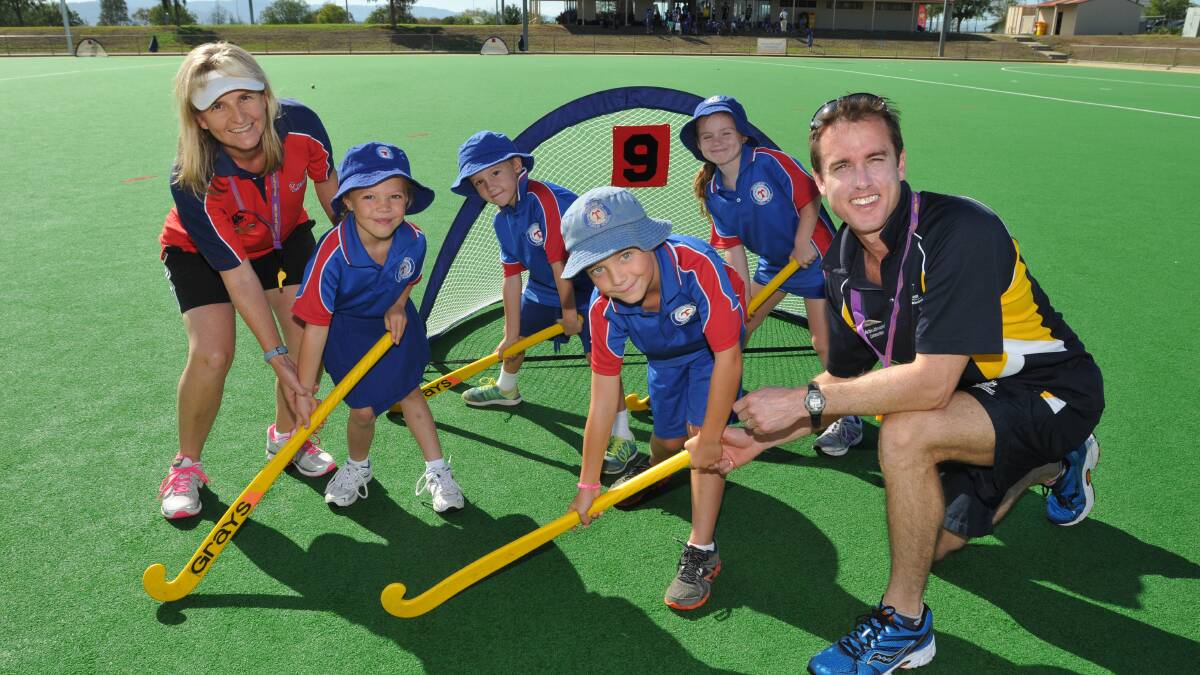 (Front) Hayden Constable and (clockwise) Ellie-Jo Tuckey,  Matthew Rushbrook and Mackenzie Scott were among 100 primary school kids that participated in yesterday's AASC hockey gala day. They're pictured with Tamworth Hockey 
Association development officer Michelle Aslin and the AASC's Justin Hathway.  Photo: Geoff O'Neill 180314GOB01