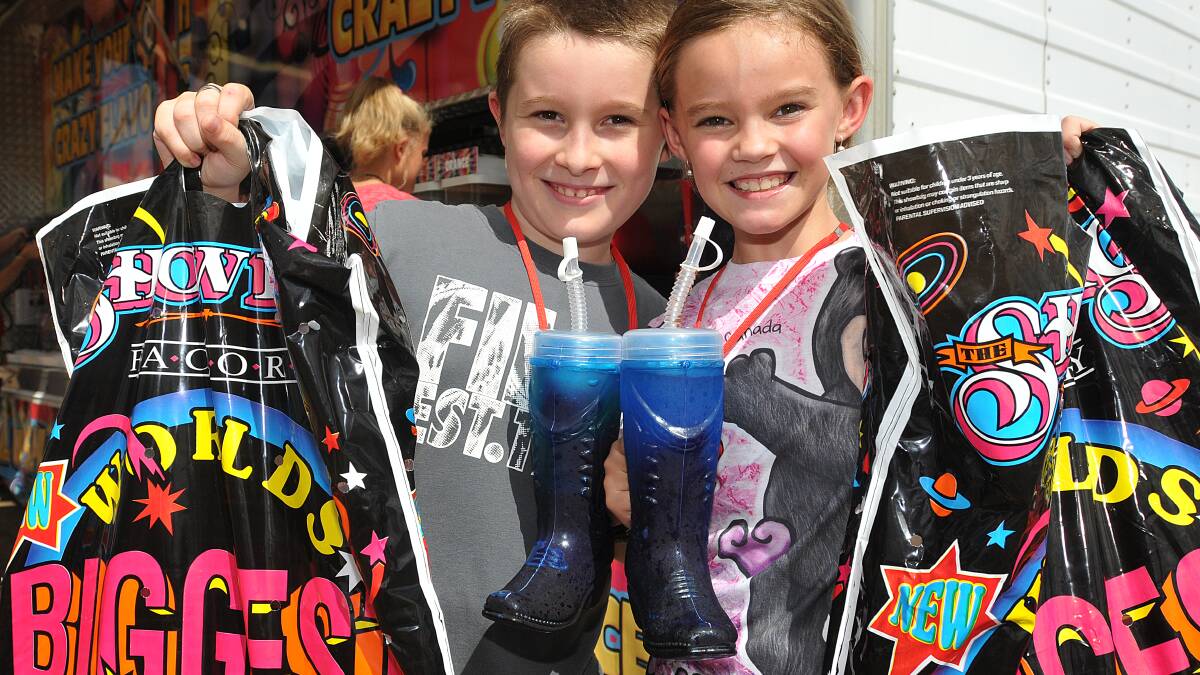 THE SHOW MUST GO ON: Connor Finucane and Rylea Felstead show off their hauls from this year's Tamworth Show, which could move away from its 
traditional home. Photo: Geoff O'Neill