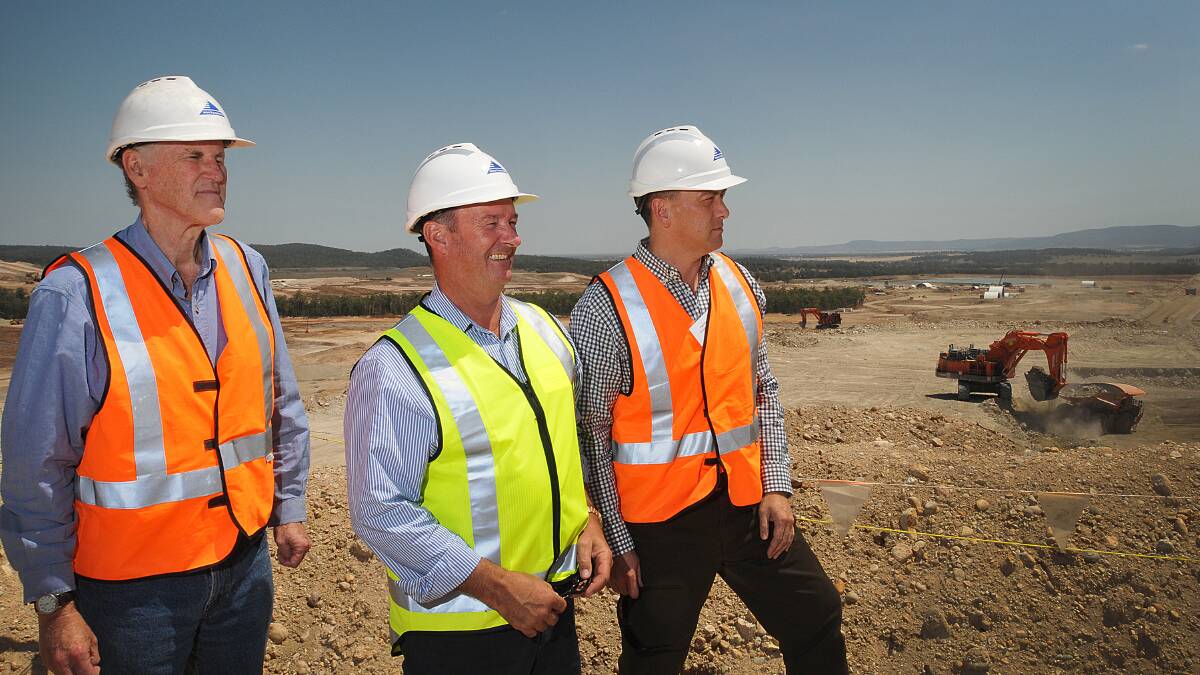 LONG ROAD: Whitehaven Coal executive general manager Brian Cole, chairman Mark Vaile and chief executive officer Paul Flynn survey construction work at the $767 million Maules Creek coalmine. Photo: Geoff O'Neill 211014GOA08