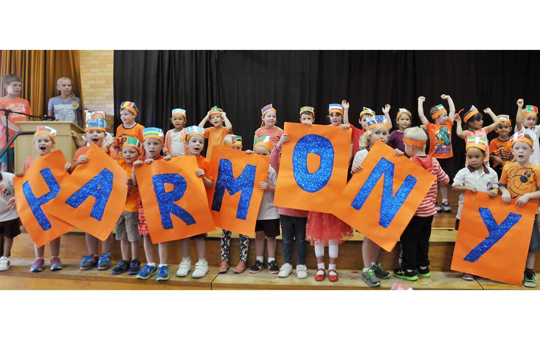 UNITED: Students from Oxley Vale Public make their feeling known about Harmony Day. Photo: Gareth Gardner 210314GGA02