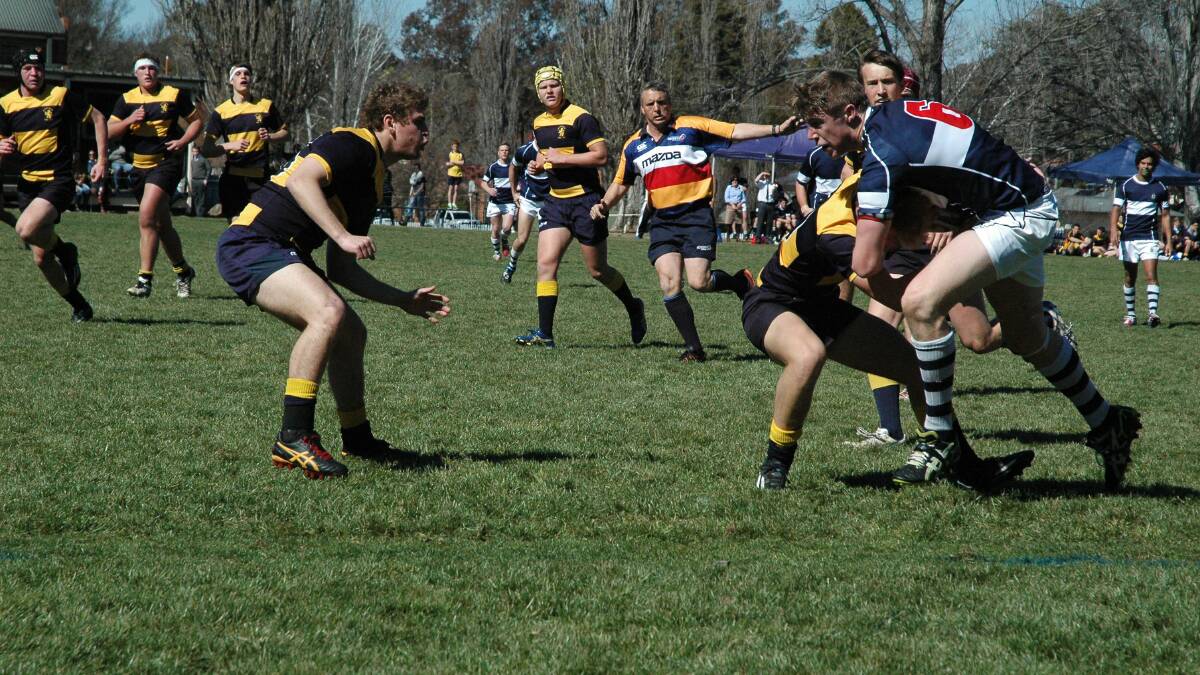 Pierce Hayden of Glen Innes surges through the defence to put the first points on the board for TAS First XV who defeated Scots Thirds 32-22 on Saturday.