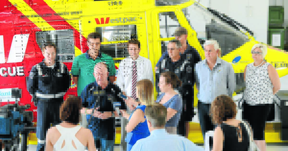 NEW HEIGHTS: Westpac Rescue Helicopter community liaison Barry Walton thanks the community for its support after the service received a new 10-year contract from the NSW government. Behind him are, from left, Trent Owen, Chris Trethewey, member for Tamworth Kevin Anderson, Dave Davies, Dean Weik, Jeff Galbraith and Lisa Thomas. Photo: Barry Smith 191214BSB02