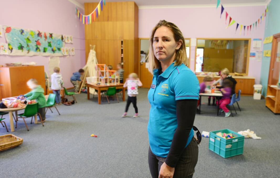NOT HAPPY, TONY: St Peters Preschool employee Simone Hurst is aghast that the federal government is thinking of canning the superannuation rebate for low-income earners. Photo: Barry Smith 050514BSB04