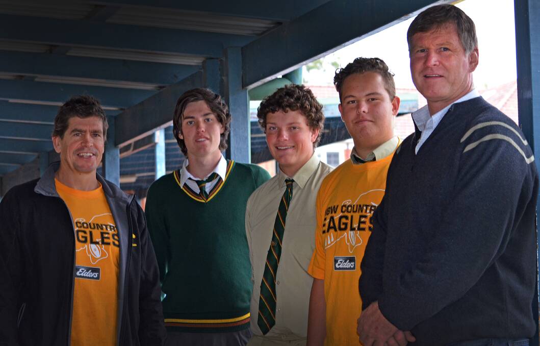 Former Wallaby and now Country Eagles GM James Grant (left) with Farrer students (from second left) Brandon Humphries, Daniel Blanch and Will Kidd with Eagles president and local Wallaby legend David Carter (right) after announcing an NRC game for Tamworth yesterday. Photo: Chris Bath 170615CBB01