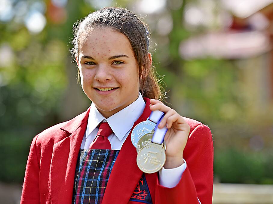 Emma Klasen and her Little A national gold and silver medals. Photo: Geoff O’Neill 050515GOD01