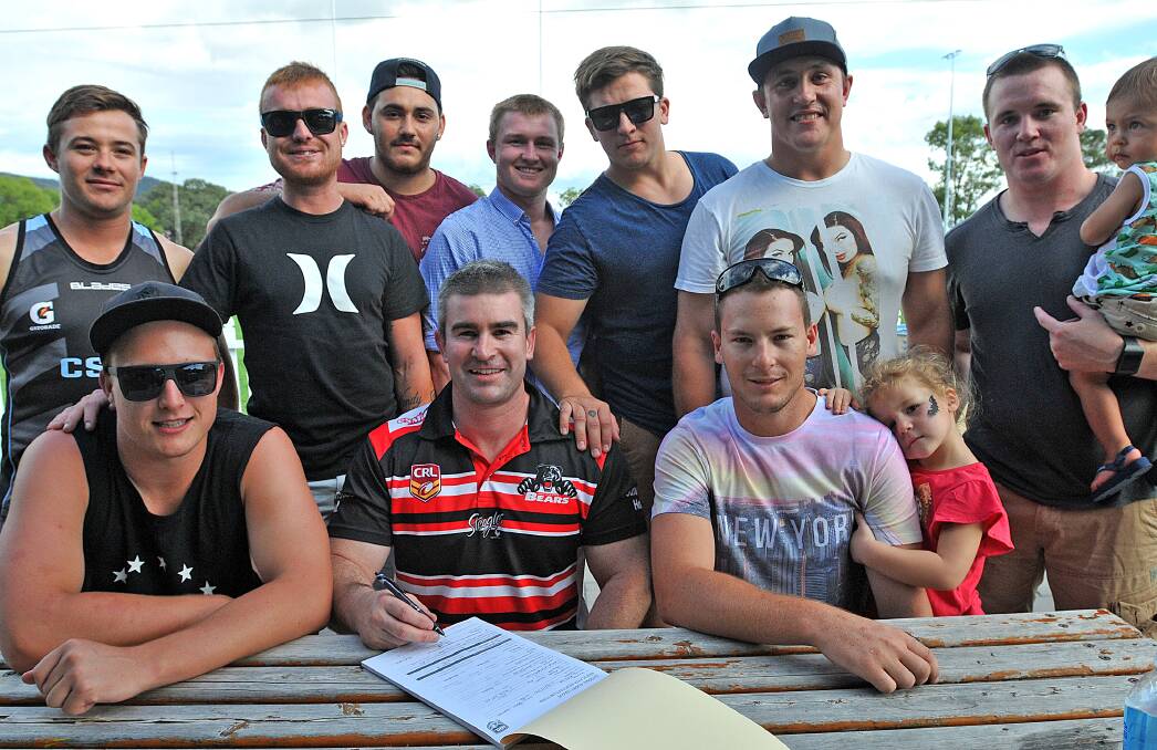 Soaking it up at Jack Woolaston on Saturday for the Bears’ picnic and sign-on day were (front from left) James Cooper, Matt Walsh, Richard Clegg with Ruby, (back from left) Kieran Fisher, Luke Fisher, Shaq Ervine, Dan Boland, Shane Wadwell, Zac Russ and Sean Russ with Max. Photo: Geoff O’Neill 061214GOE01