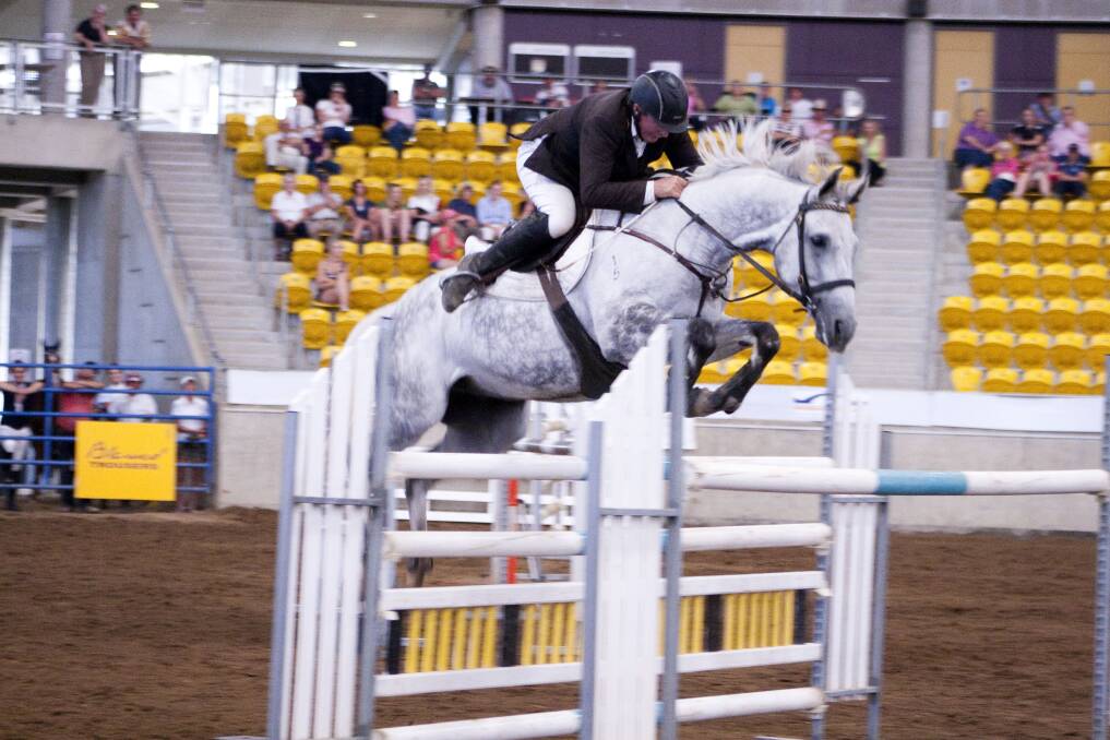 Local rider Ron Easey won the Peel River Produce Grand Prix ahead of some talented Queenslanders in a spectacular final round at the Indoor Show Jumping Championships at  Tamworth last year. He returns to Tamworth this weekend searrching for more jumping success. 