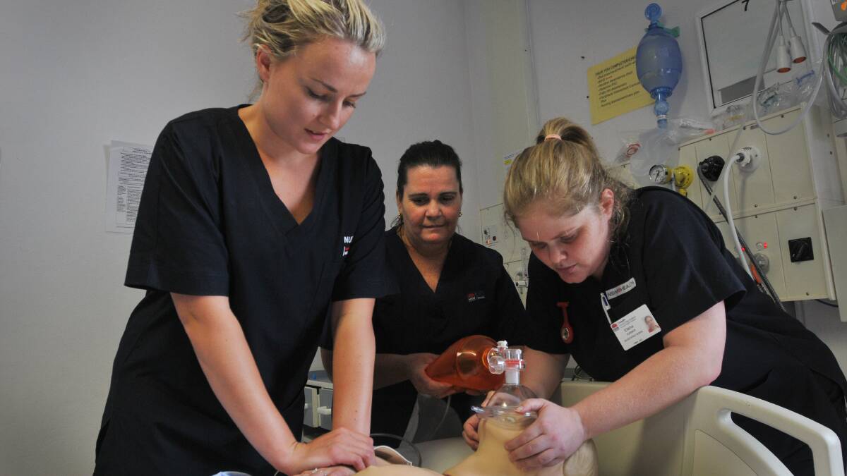 SAVING LIVES: Tamworth Hospital ICU graduates, from left, Bianca Mitchell, Tina Cain and Elisha Turner show off some of the skills they learned during 12 months of intensive specialty training. Photo: Gareth Gardner