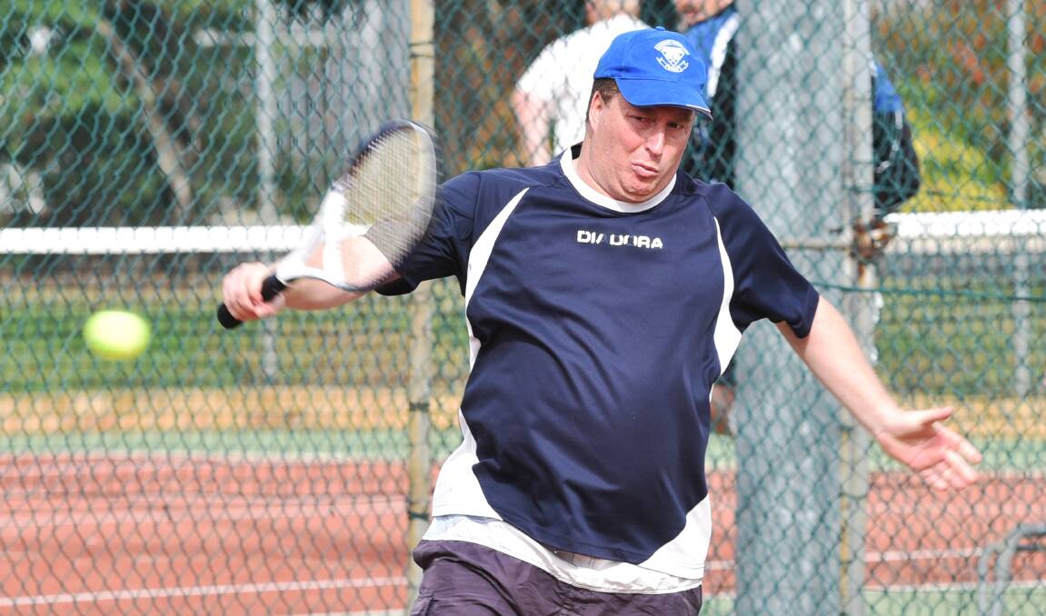Tom McGinnes backhands this return during the West Tamworth Tennis Club’s Seniors Tournament on the weekend. Photo: Geoff O’Neill 230515GOB05