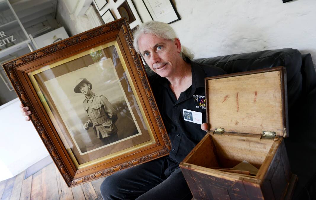 PRESERVING HISTORY: McCrossin’s Mill collection manager Mal Boyd with Cecil Stoker’s portrait and letters and the tin trunk in which the letters were discovered. Photo: Barry Smith 300315BSE02