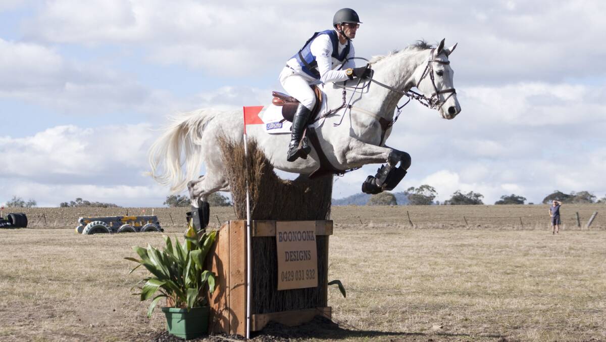 Stuart Tinney held on to his dressage lead with a perfect cross country round on War Hawk, finishing exactly on the optimum time of eight minutes.