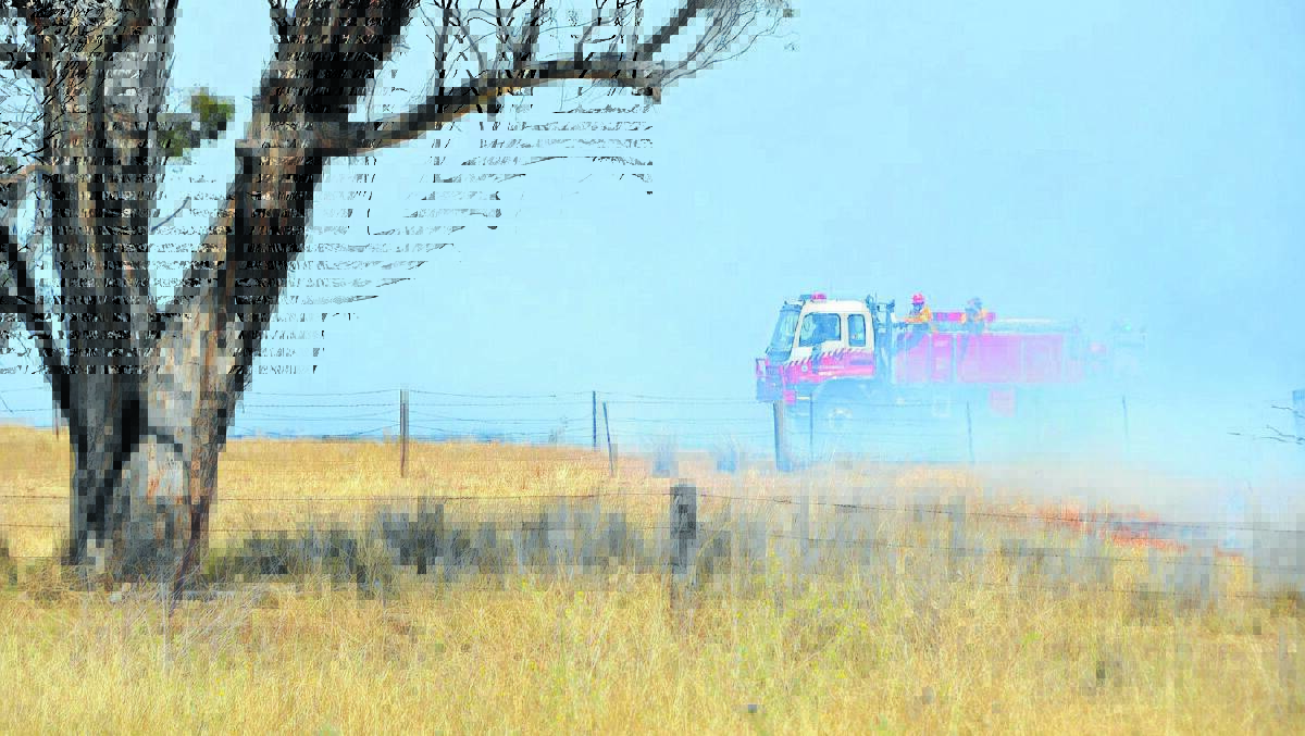 FAST MOVING: Two waterbombing aircraft were deployed to help crews tackle the blaze near the Oxley Highway at Carroll yesterday afternoon. Photo: Namoi Valley Independent