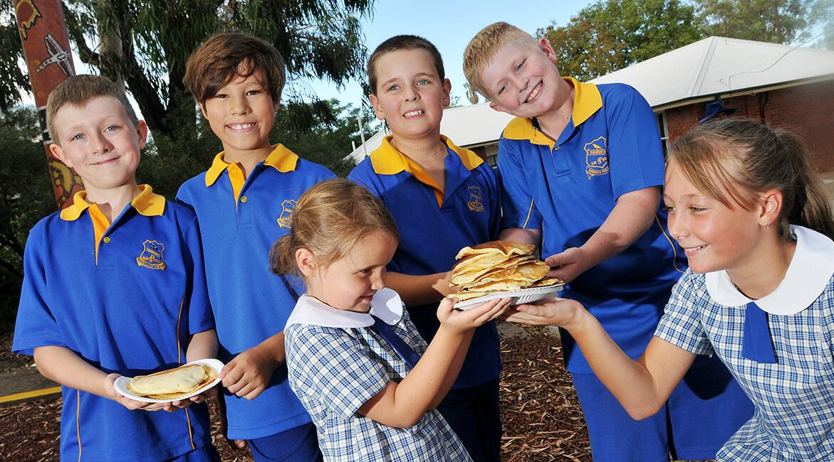 BATTER UP: Getting into the spirit of Pancake Day at Tamworth Public School yesterday are (back, from left) Hayden Moore, Liam Dunstan, Conor Jones 
and Ryan Post and, front, Ella Jones and Alana Dickinson.  Photo: Gareth Gardner 040314GGA03