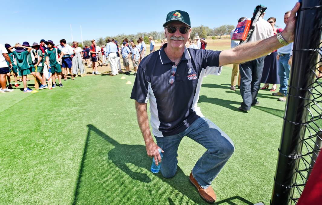 Dennis Lillee takes a knee next to the plaque that he unveiled at the opening of the new Calrossy Cowper cricket nets. Photo: Geoff O'Neill 260315GOC05