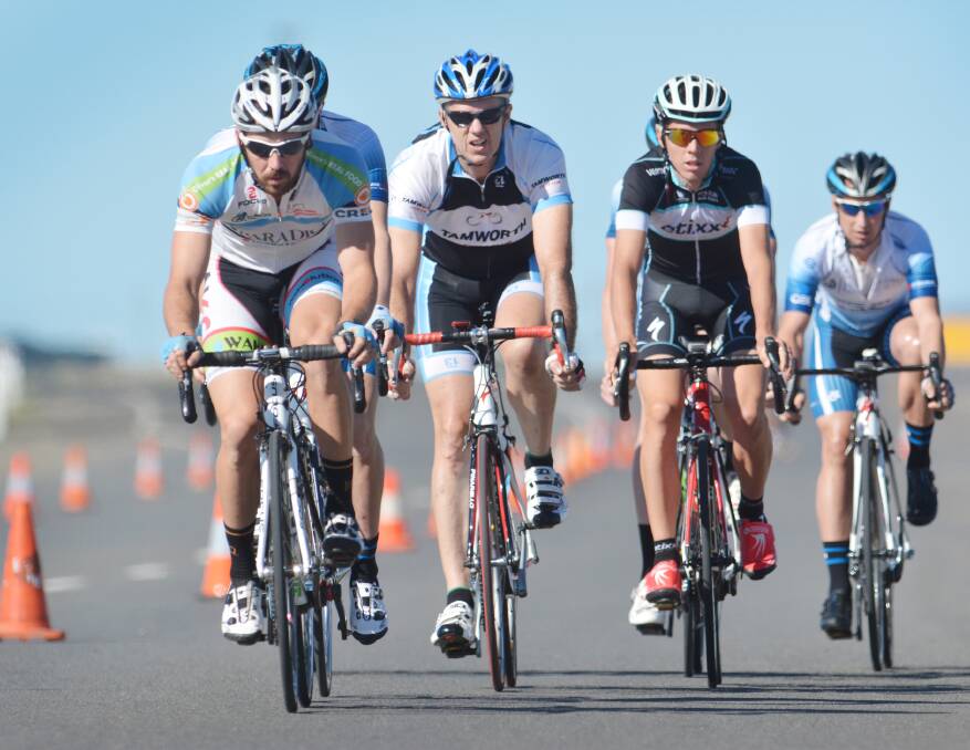 Mitch Carrington leads Darren Taylor and Sam Spokes in a recent A grade crit. Carrington was leading the way in a Newcastle Kermesse last Saturday.  Photo: Barry Smith 141214BSA16
