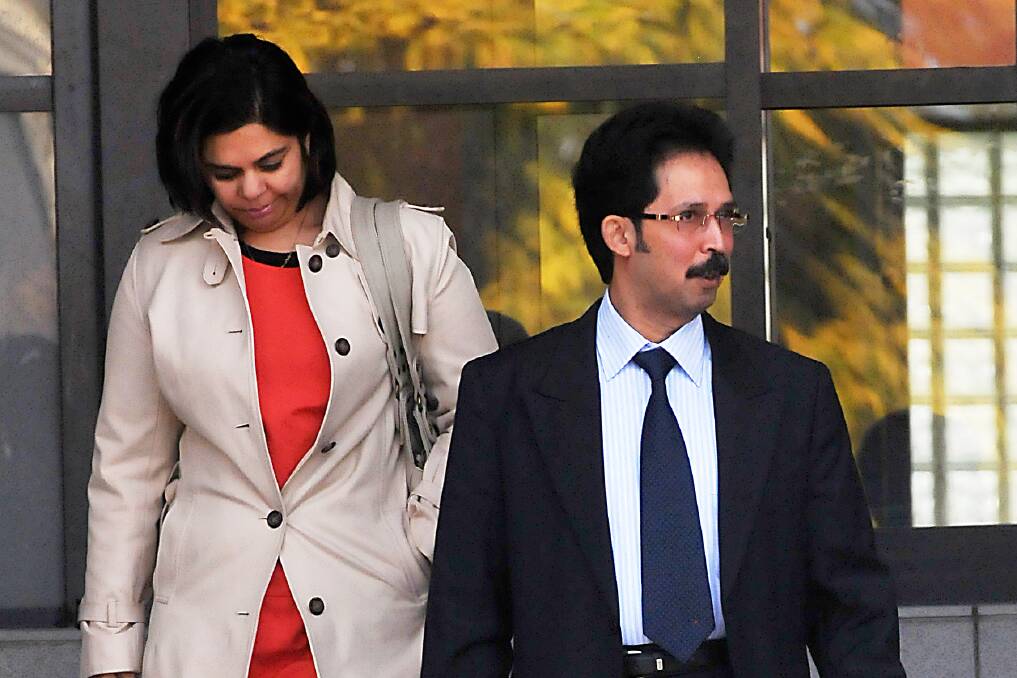 FRAUD CASE: Rajesh Upadhyaya and his wife leave Tamworth court at an ealier court appearance. Photo: Geoff O’Neill 150812