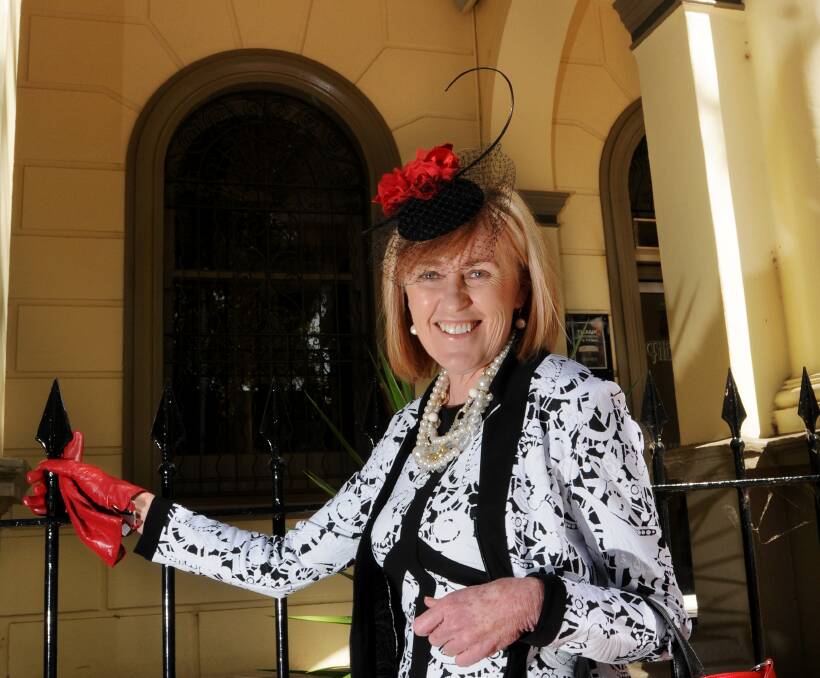 AUTUMN RACEWEAR: 
Sue Warden shows off an outfit supplied by Town & Country boutique in Peel St, Tamworth, in preparation for Sunday’s Tamworth Cup. Photo: Gareth Gardner 220414GGA01