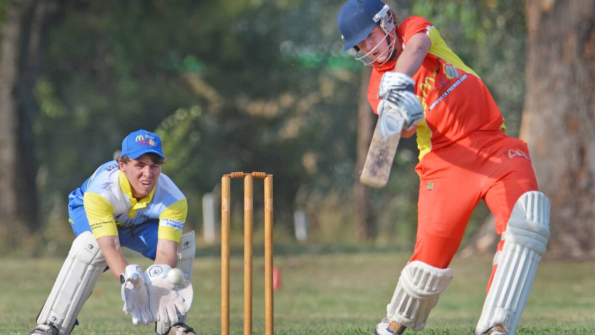 Keyton Hislop cover drives for Maccas last Friday as Hurricanes skipper Matt Everett looks on. Photos: Barry Smith 141114BSC06