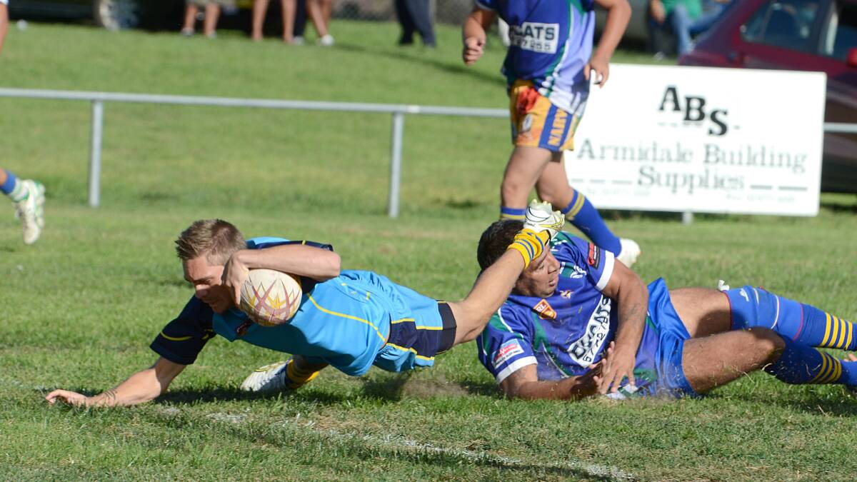 Seventeen-year-old Oxley Diggers half Scott Berry dives over next to the posts for the opening try of the match during their recent trial against Armidale. The Diggers and Berry will be back in action today against Uralla. Photo: www.pixonline.com.au