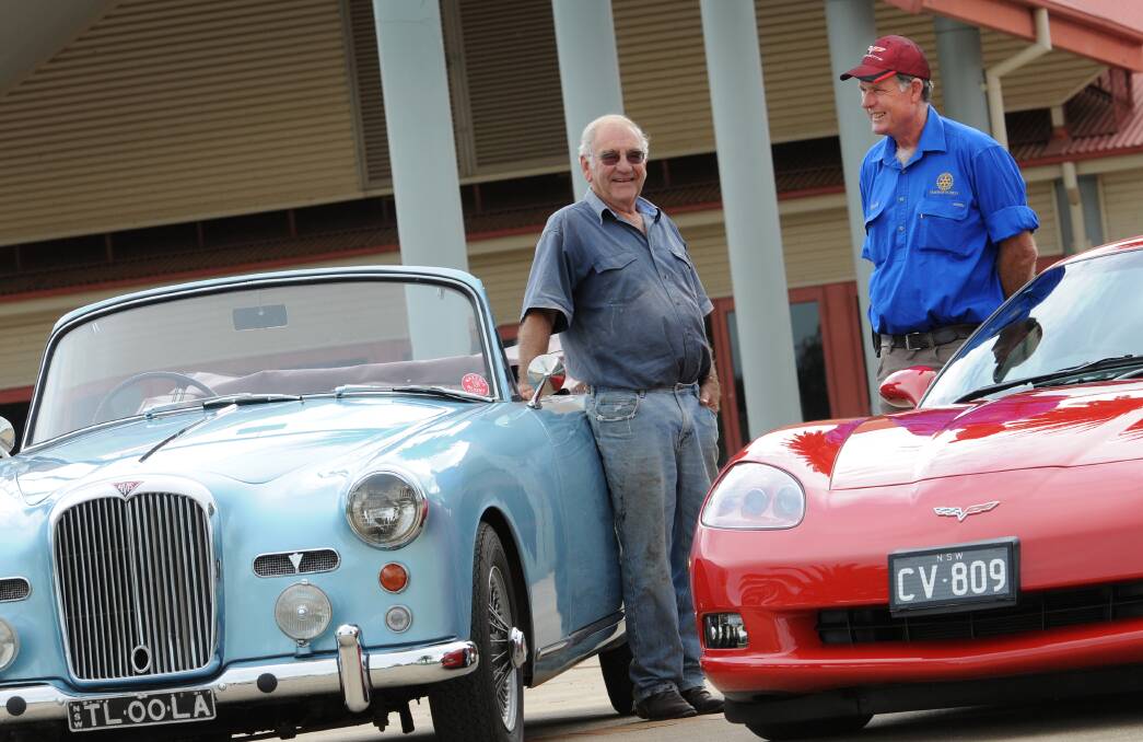 ENTHUSIASTS: Roddy Wyllie and Neville Evans gear up for this 
weekend’s car show. Photo: Gareth Gardner 100414GGF02