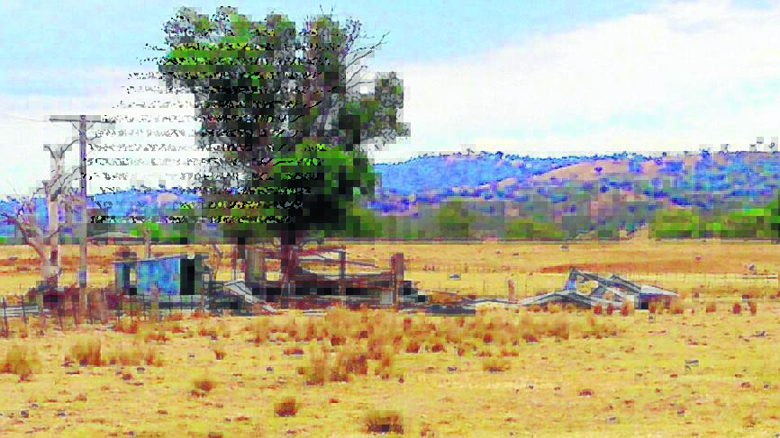 BLOWN AWAY: Strong, gusty winds ripped apart this shed at Barraba during Monday’s storms. Photo: Peter Dwyer