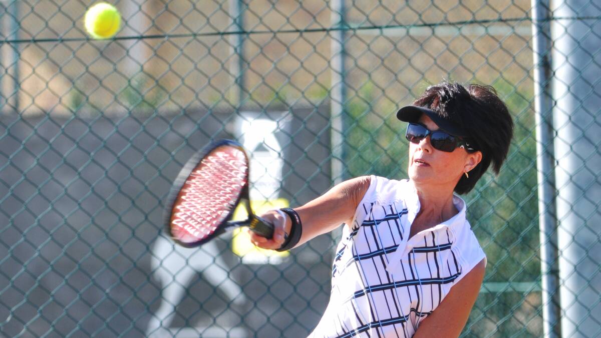 Sue Chillingworth gives it a bash at the seniors tennis tournament. Photo: Geoff O'Neill 240514GOB08