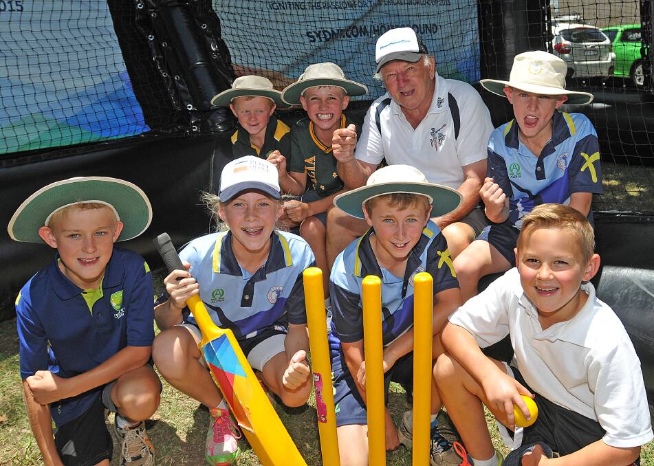 Happy birthday Doug. Test legend  Doug Walters with (front from left) Samuel Holmes, Lara Graham, Matthew Holmes,
 Charlie Henderson and  (back from left) Thomas Holmes, Will Jarrett, Oliver McGill at the Home Ground Tour in Tamworth on Saturday. Photo: Geoff O'Neill 201214GOA01