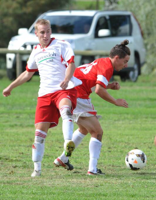 Gunnedah Hawk Charlie Vernon is on the wrong side of this tackle with young Mushies star Aiden Flynn. OVA won 5-0. Photo: Geoff O’Neill 290314GOC02