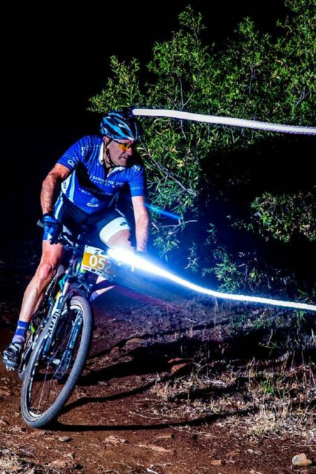 Ray Griffin takes a corner in the recent 12 hour Dusk to Dawn mountain bike race in Tamworth. Photo courtesy of Charlie Coulton.