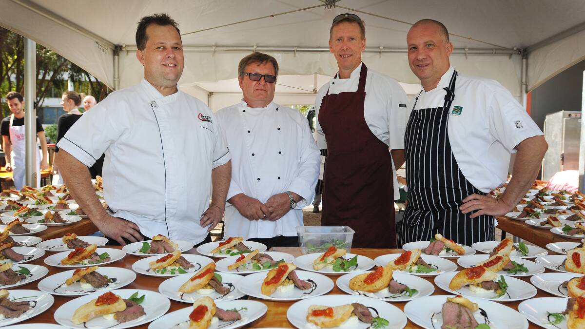 FOOD MASTERMINDS: From left, local chefs Corey Walmsley, Phillipe Kanyaro, Rob Breese and Ben Davies plate up food for 245 diners during Taste Tamworth’s Long Lunch earlier this month. Photo: Geoff O’Neill 130414GOE02