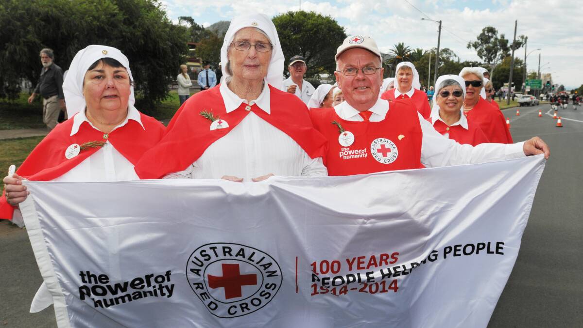 CENTENARY CELEBRATIONS: Red Cross members, from left, Kay Ledwos, Dawn Wheeler and Ken Hall were proud to march with other Red Cross members in the Anzac Day march in Tamworth. Photo: Geoff O’Neill 250414GOC01