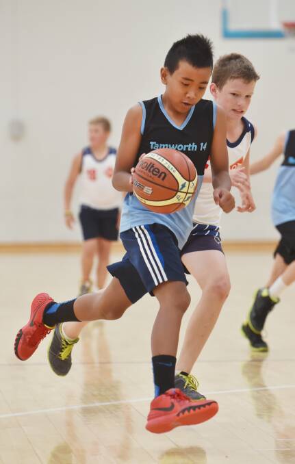 South Tamworth’s Mark Ocampo dribbles strongly up the court.  Photo: Barry Smith 260215BSB08